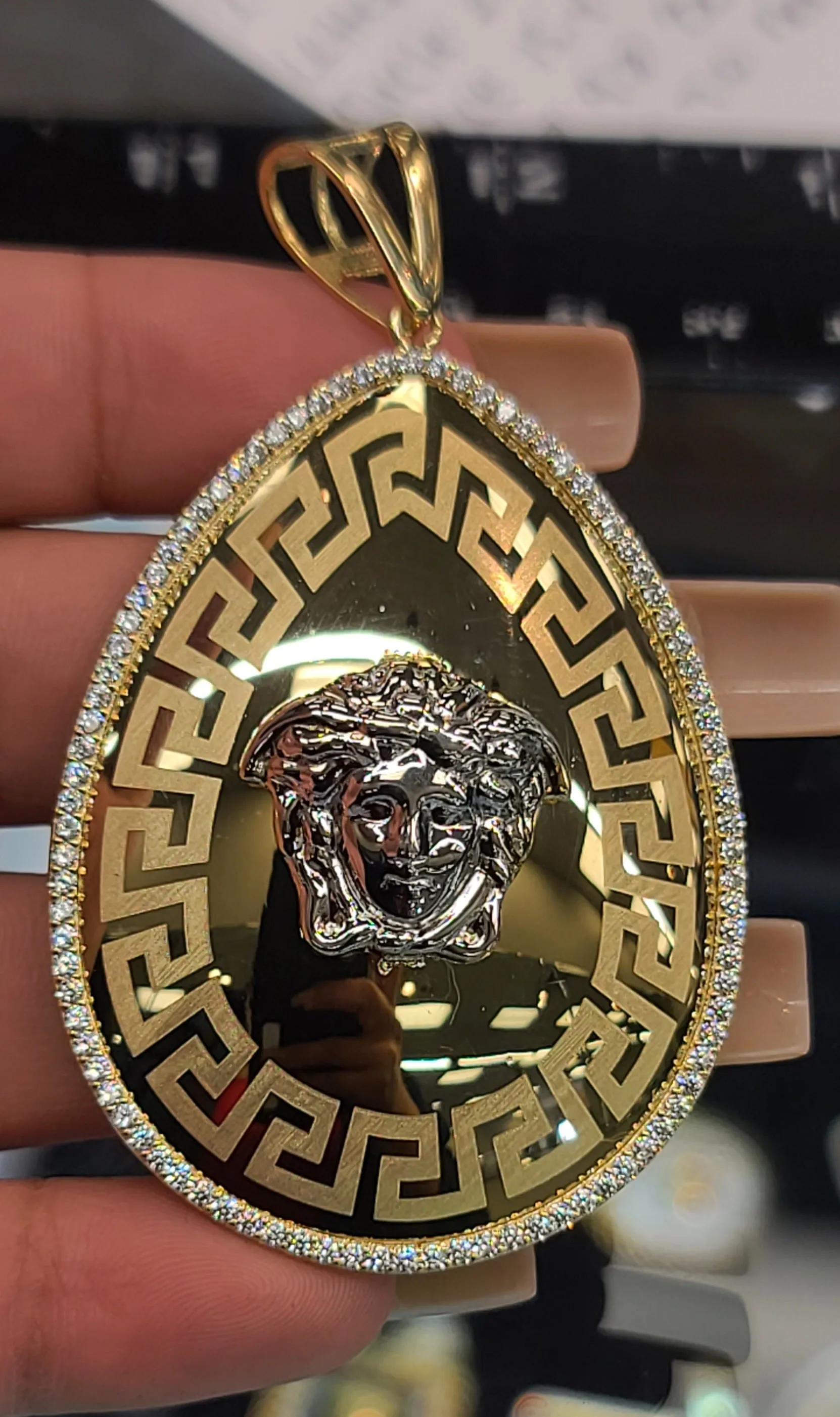 Yellow Gold Oval Pendant With Medusa Face and CZs